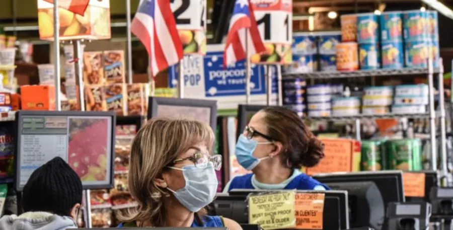 Grocery Store worker wearing a mask